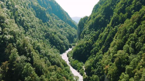 aerial view of a lush mountain valley with a river