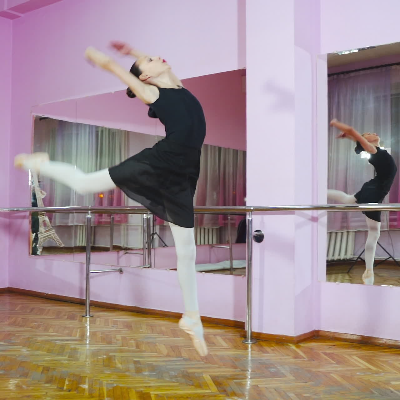 Slow motion. Professional ballerina perform pirouette in the ballet hall. A little dancer.