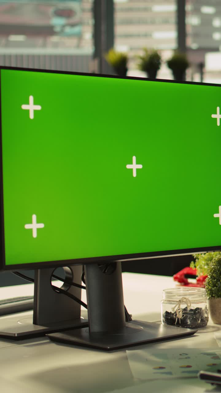 Vertical video Office clerk working on green screen mockup PC