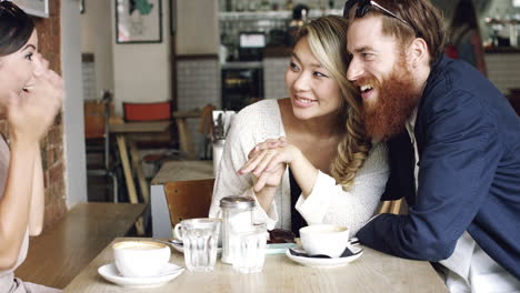 woman showing engagement ring friends celebrating