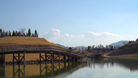 people visiting lake garden in suncheonman bay national garden, suncheon, south korea