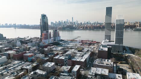 aerial establishing shot of manhattan skyline from brooklyn on overcast afternoon in winter