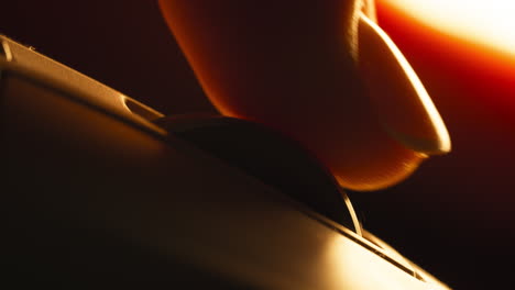 close-up of a finger scrolling the wheel of the computer mouse.