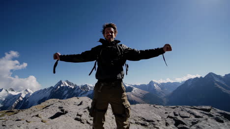happy man on mountain summit