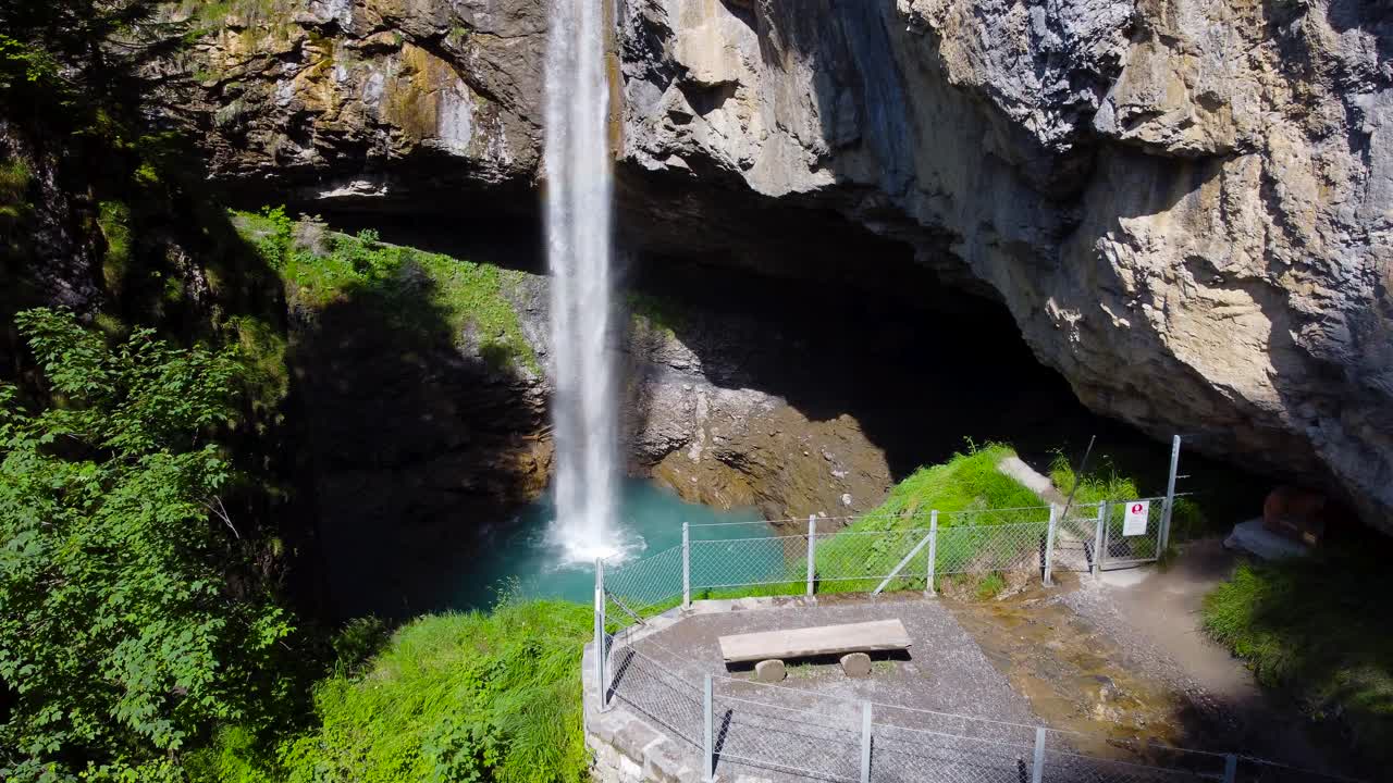 Aerial Shot Flying Toward Berglist&uuml;ber Waterfall in Swiss Alps in Switzerland, 4K Drone