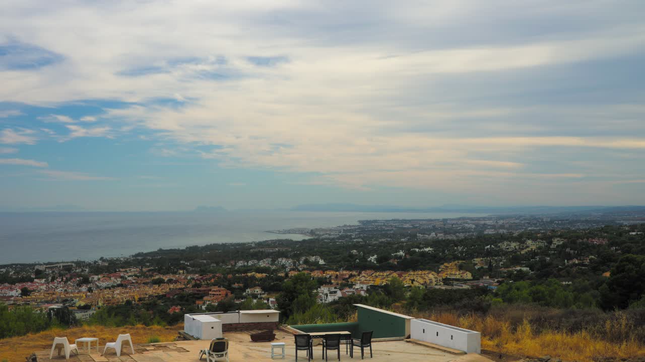 Panoramic hilltop view of Marbella with overcast sky, Spain