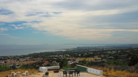 panoramic hilltop view of marbella with overcast sky, spain