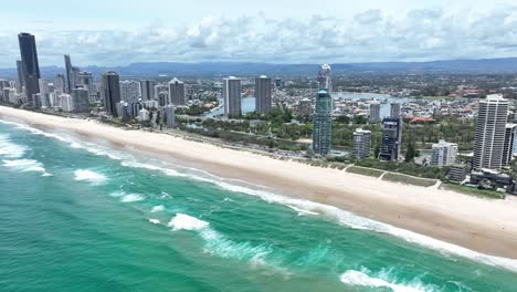 surf crashing on the world famous beaches of surfers paradise, gold coast, queensland australia, stunning views, golden sands