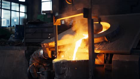 Pouring-bright-hot-liquid-steel-or-metal-from-ladle-in-blast-furnace-foundry-metallurgical-factory