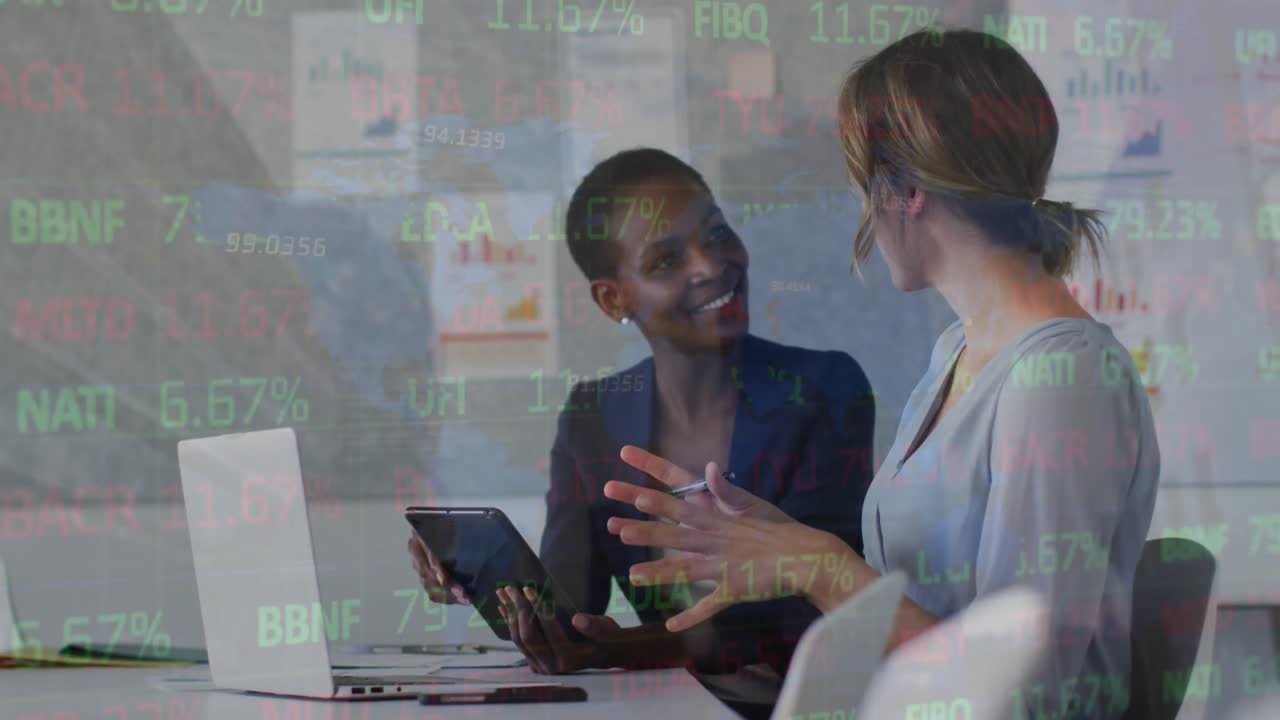 Animation of financial data and graphs over diverse female coworkers in office