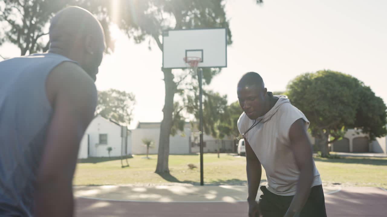 People playing basketball outdoors