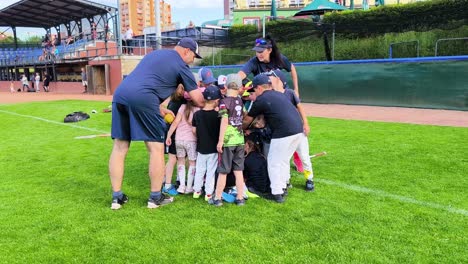 A Group of Children Engaging in Hand Stacking Before a Casual Baseball Game at Arrows Baseball Field in Ostrava, Czech Republic - Slow Motion