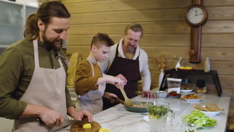 caucasian men and boy in the kitchen