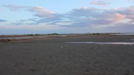 Slider-shot-golden-sunset-on-sandy-beach-and-waves