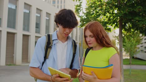 two students studying together on campus