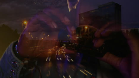 photographer hands adjusting dslr lens over highway merging light trails with floating tech icons