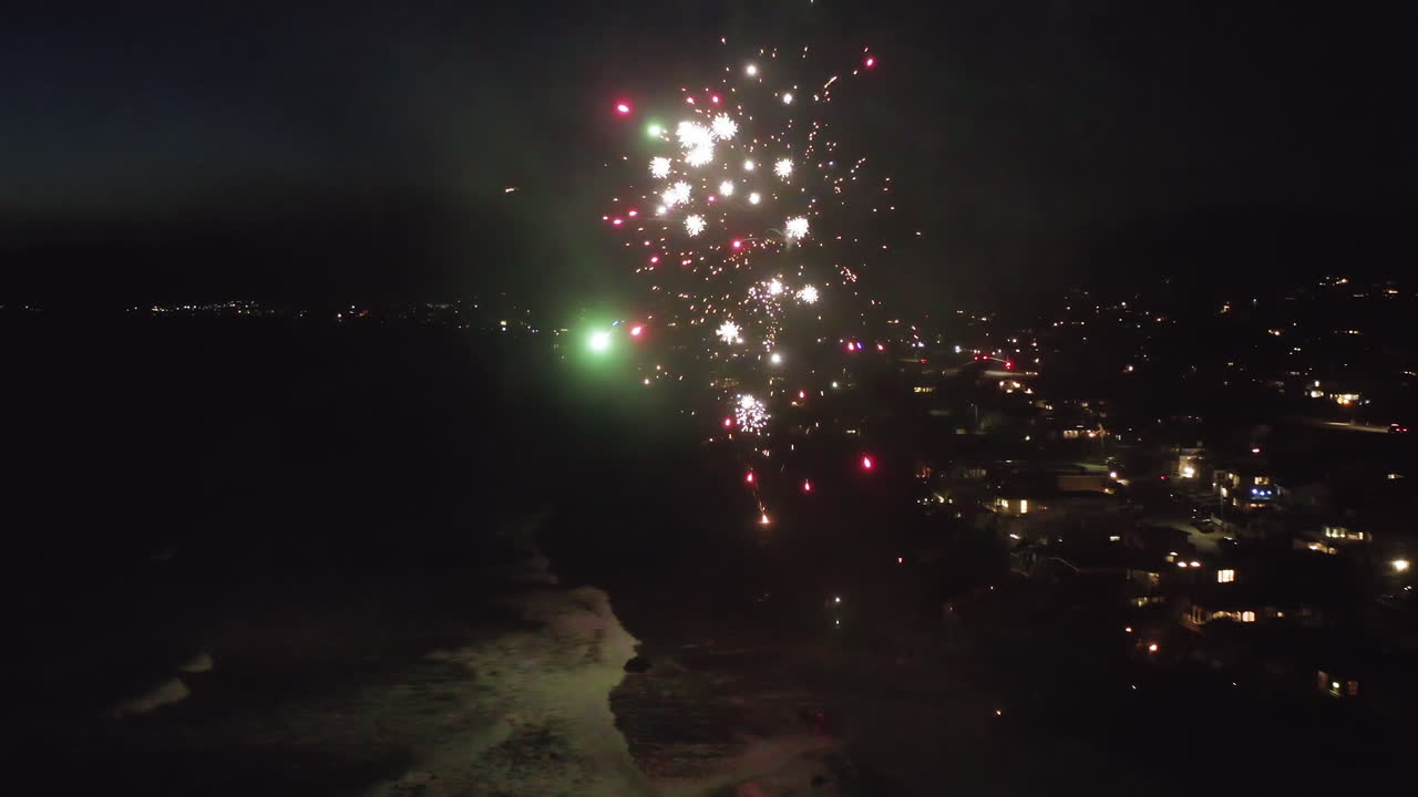 Spectacular Night Fireworks Over a Coastal City