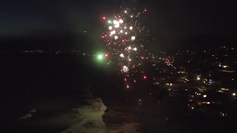 spectacular night fireworks over a coastal city