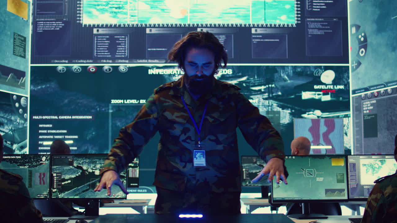 Infantry unit leader studies satellite imagery on a holographic image