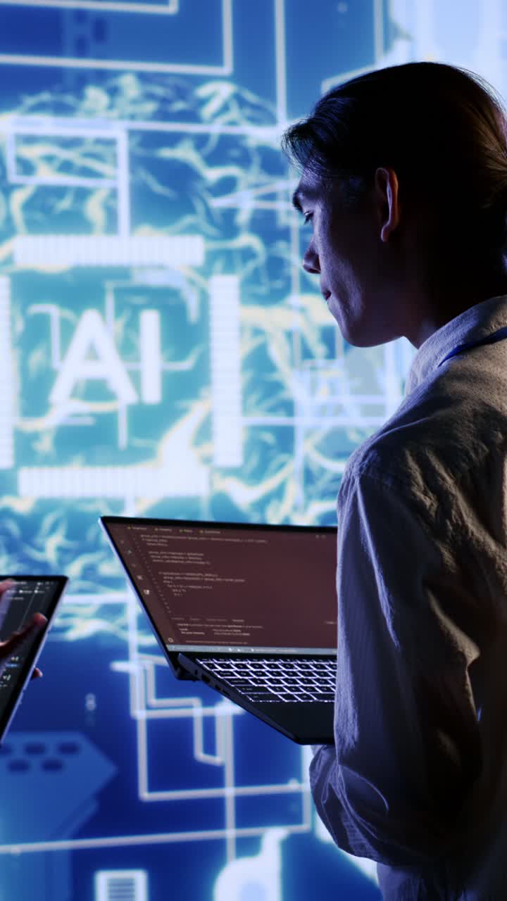 Vertical video Team members oversee AI neural network