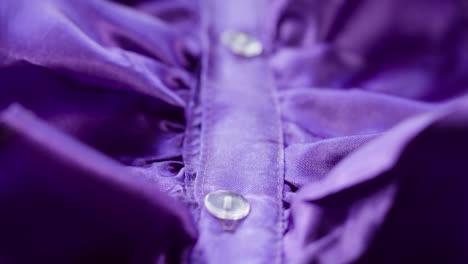 purple ruffles close-up. sewing a violet dress. handmade tailoring, professional clothing concept. abstract background