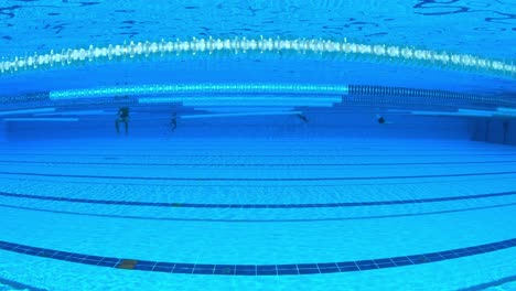 olympic swimming pool under water background.