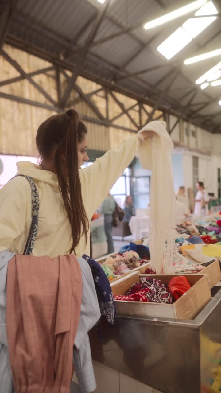 Woman Shopping for Clothing at a Thrift Store