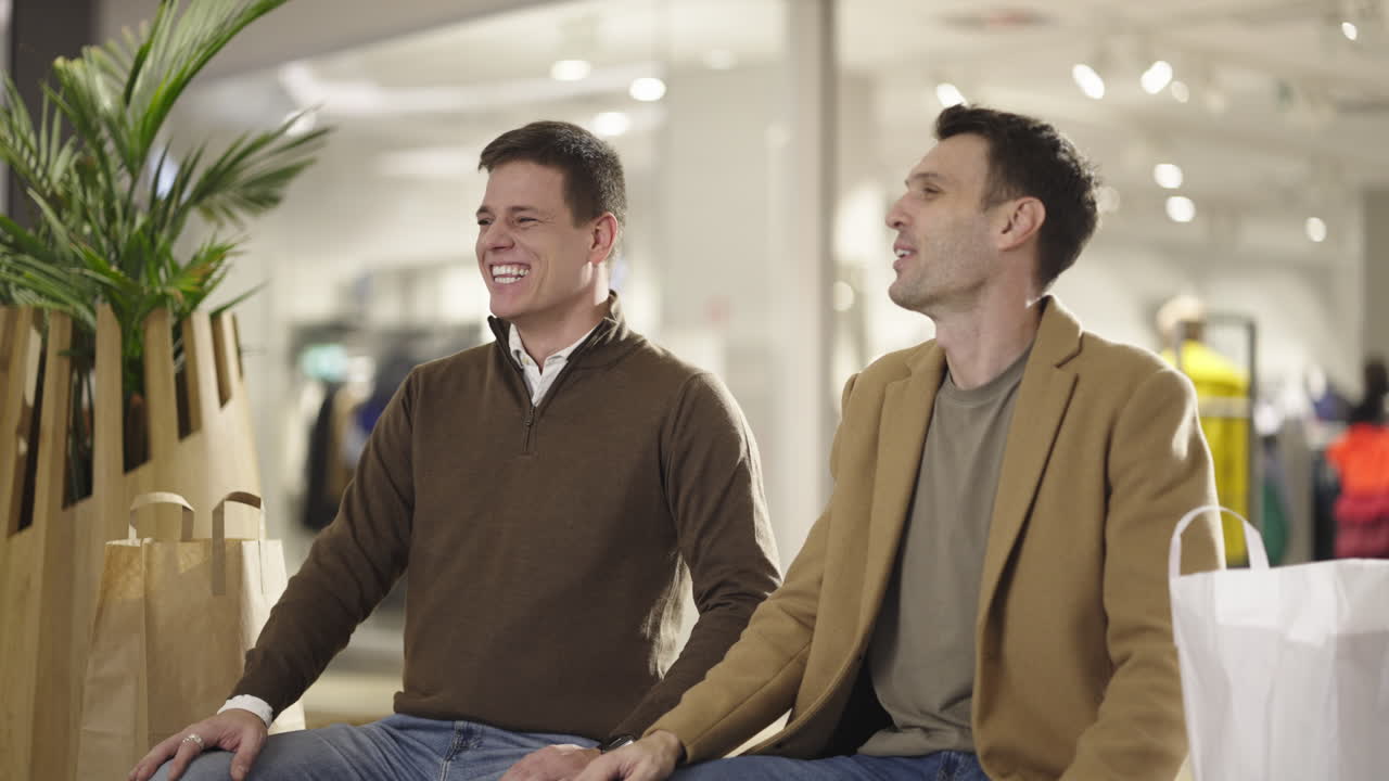 Two Friends Laughing and Talking During a Shopping Trip