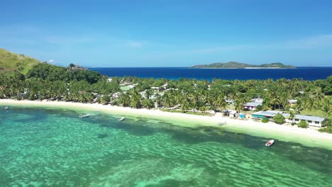 An-Aerial-View-Shows-Boats-Docked-On-The-Beach-Of-Yanuya-Island-Fiji-1