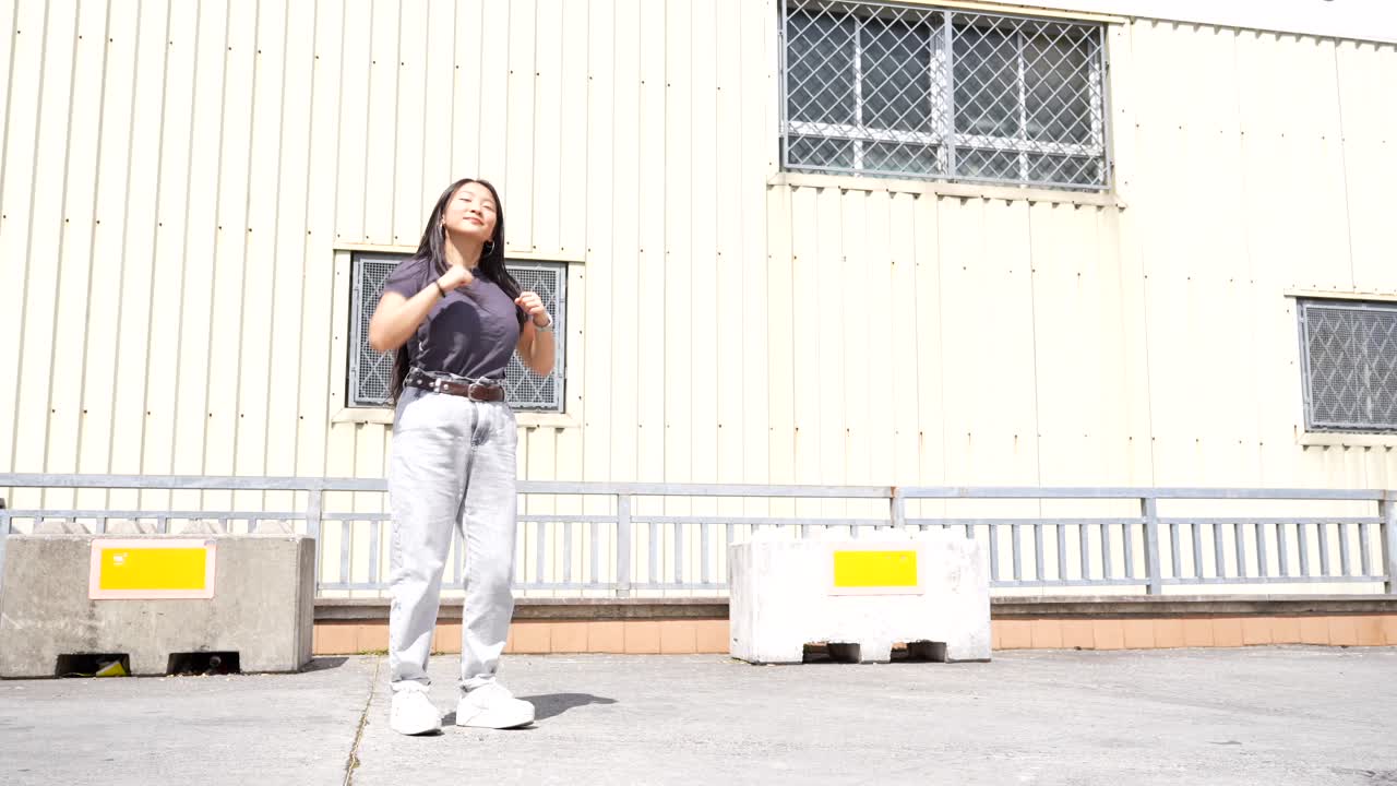 Woman dancing in an urban setting