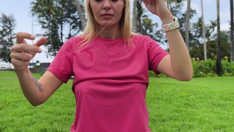 woman beading in a park