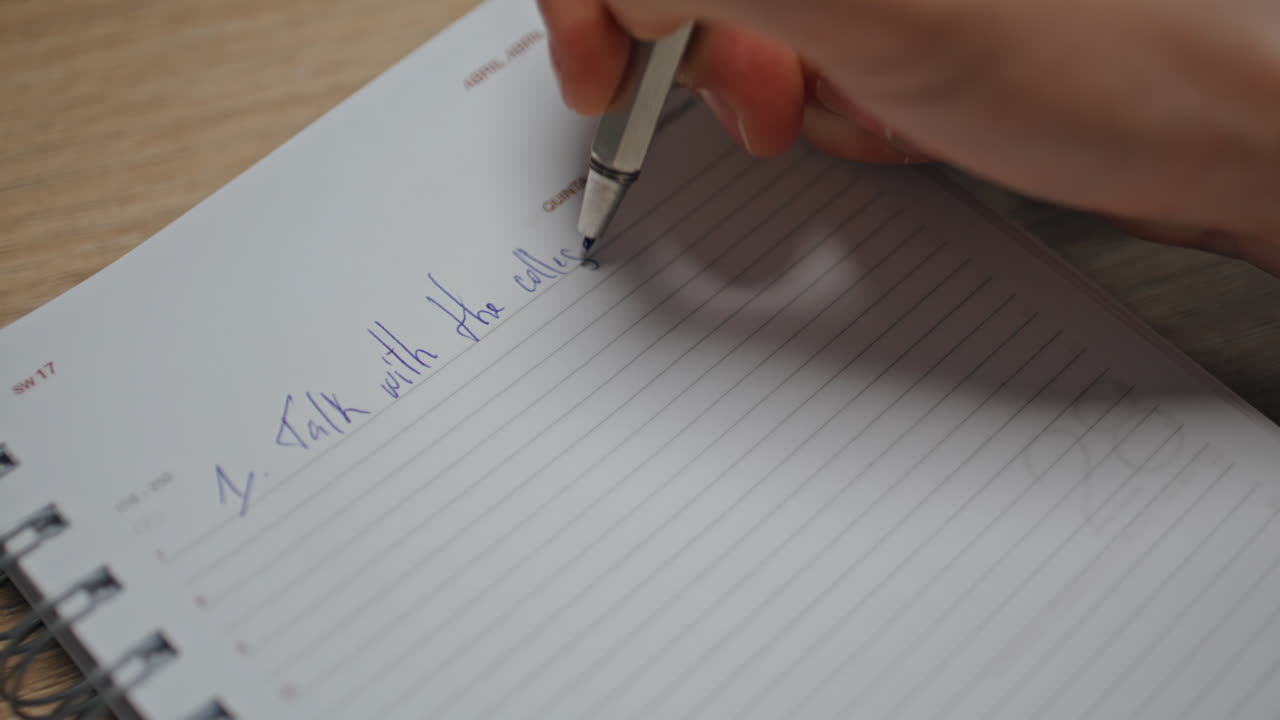 Creator fingers writing notebook at table workplace closeup. Man hands noticing