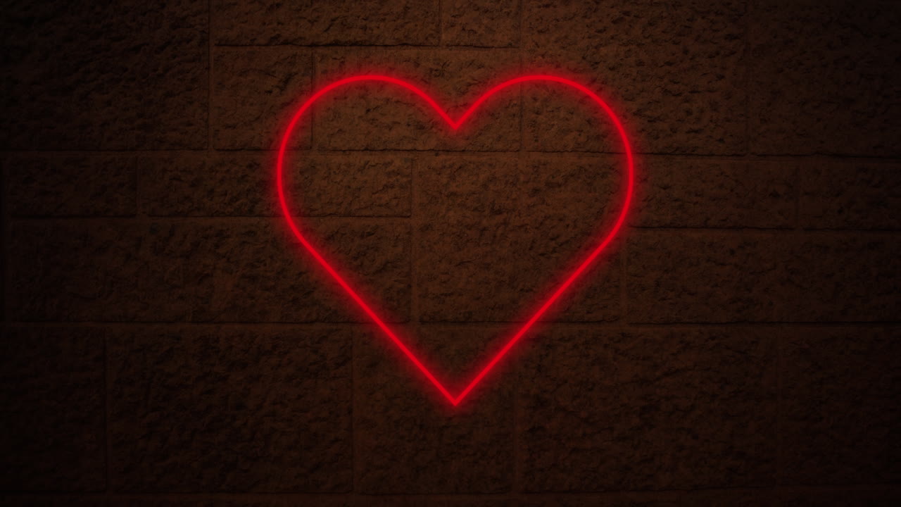 Insegna al neon a forma di cuore su muro di mattoni 4k