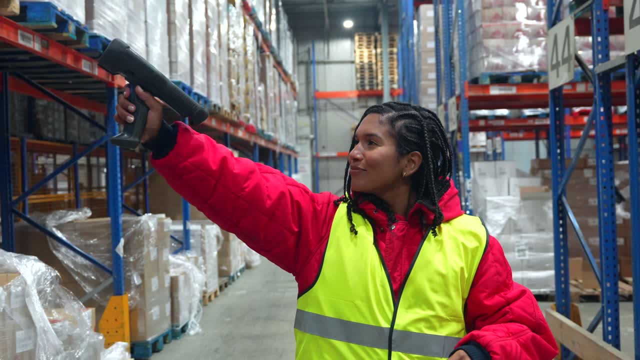 Warehouse worker scanning barcodes in a warehouse