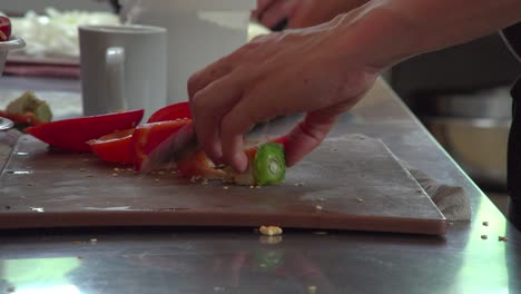 a chef prepares and discards part a freshly cut sweet pepper