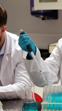 two scientists doing a chemical experiment