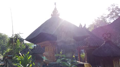 Balinese-Architecture-Traditional-Bali-Temple-Roof,-Sidemen-Karangasem-Daylight-Village-Atmosphere-with-Green-Trees-and-Local-Street