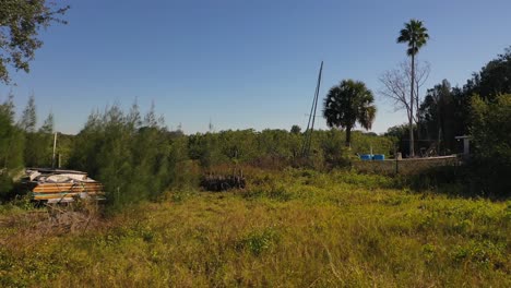 Sailboat-grounded-near-marsh-in-Hudson,-Florida