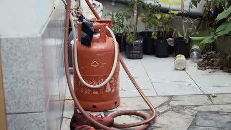 propane gas cylinder placed outdoor safely for cooking