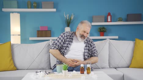 el hombre tiene dolor de estómago.