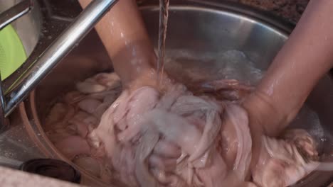 traditional hand washing of pork intestines in portugal slow motion