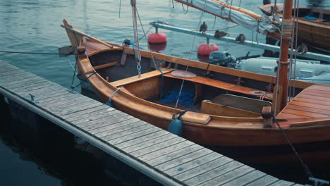 moored wooden boat in the marina at sunny summer day