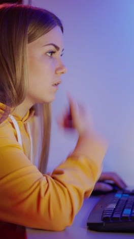 woman using computer. young woman sitting at table and using computer
