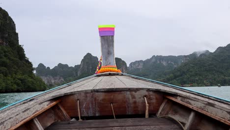 longtail boat trip through limestone islands in krabi, thailand