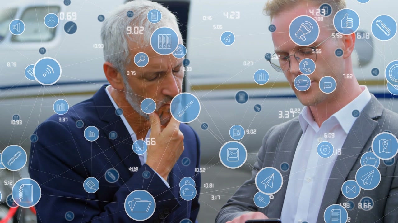Animation of network of digital icons over two caucasian businessmen using smartphone at the airport