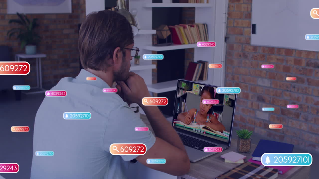 Animation of colorful data tags floating around man working on laptop in home office