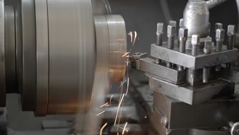 close up of lathe machine and sparks in the industrial factory. slow motion