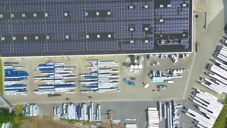 Aerial-view-of-modern-storage-warehouse-with-solar-panels-on-the-roof