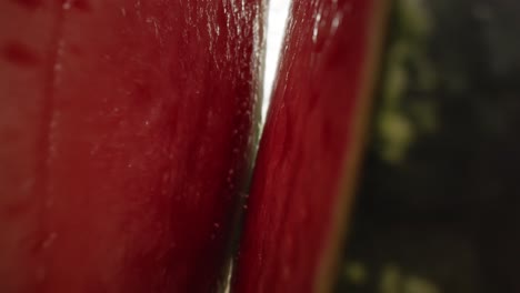 zoom in macro video of  watermelon opening into halves