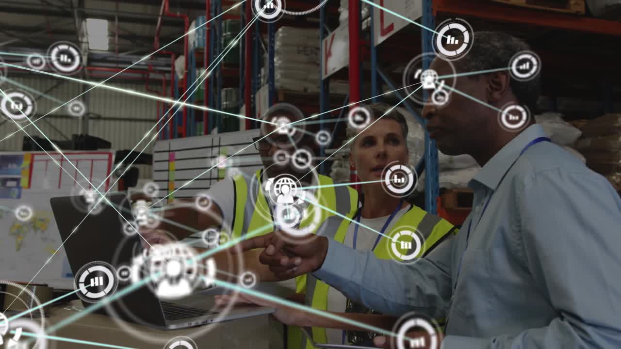 Warehouse team using laptop, center operator starting network overlay covering team, checking stock